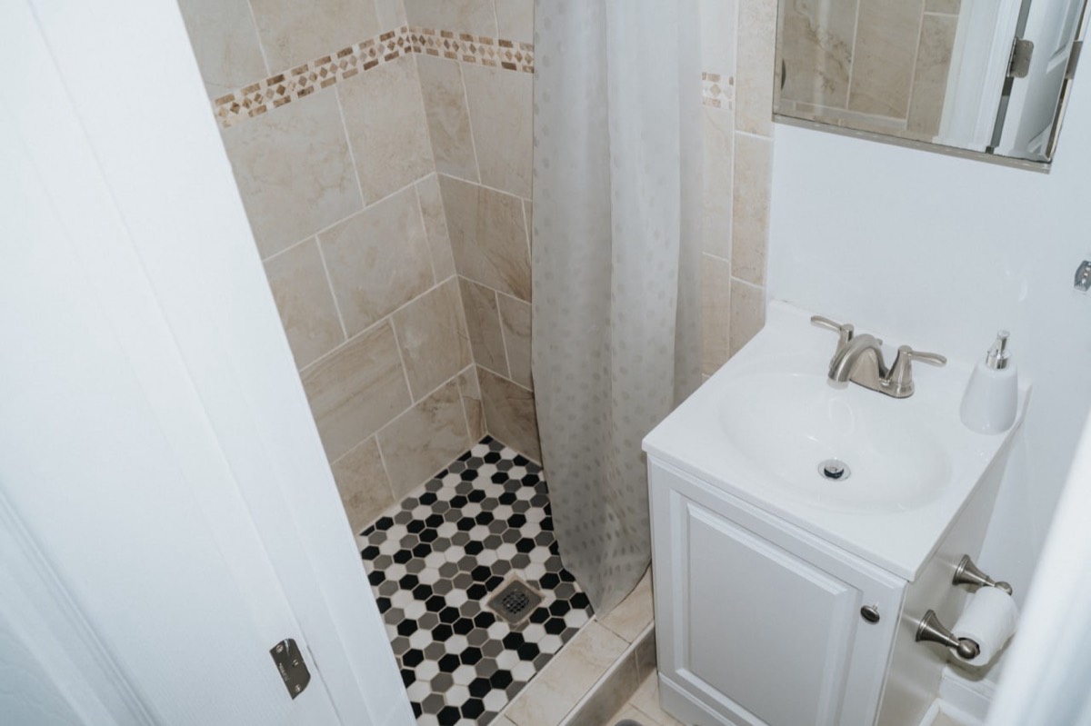 Tiled walk-in shower and vanity