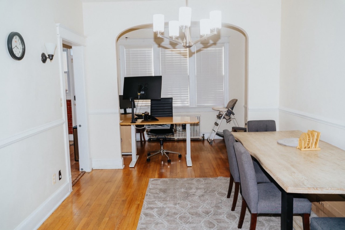Dining room with archway and hardwood floors